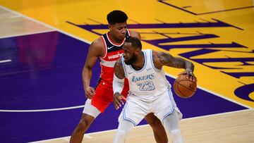 Feb 22, 2021; Los Angeles, California, USA; Los Angeles Lakers forward LeBron James (23) moves the ball against Washington Wizards forward Rui Hachimura (8) during the second half at Staples Center. Mandatory Credit: Gary A. Vasquez-USA TODAY Sports