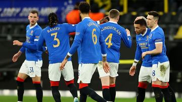 DORTMUND, GERMANY - FEBRUARY 17: James Tavernier celebrates with teammate Ryan Jack of Rangers after scoring their team's first goal during the UEFA Europa League Knockout Round Play-Offs Leg One match between Borussia Dortmund and Rangers FC at Foot