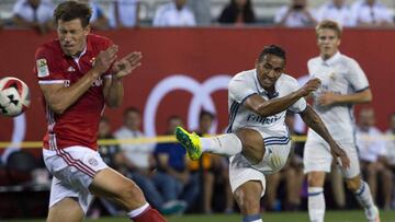 Real Madrid's Danilo (C) scores past Bayern Munich's Nicolas Feldhahn during the International Champions Cup match betweeen FC Bayern Munich and Real Madrid CF August 3, 2016 at MetLife stadium in East Rutherford, NJ. / AFP PHOTO / DON EMMERT