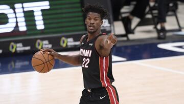 Miami Heat forward Jimmy Butler (22) points during the second half of an NBA basketball game against the Washington Wizards, Saturday, Jan. 9, 2021, in Washington. (AP Photo/Nick Wass)