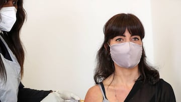 Robyn Porteous, a vaccine trials' volunteer, is injected with a vaccine as part of the country's human clinical trial for potential vaccines after being tested for the coronavirus disease (COVID-19), at the Wits RHI Shandukani Research Centre in