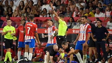 Girona's Spanish forward Portu receives medical attention during the Spanish Liga football match between Girona FC and Real Madrid CF at the Montilivi stadium in Girona on September 30, 2023. (Photo by Josep LAGO / AFP)