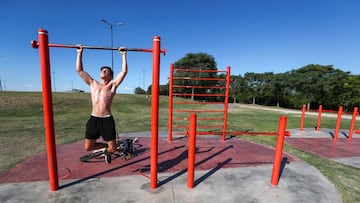 A boy does push ups at a public park during a heat wave amid the outbreak of the coronavirus disease (COVID-19), in Buenos Aires, Argentina January 25, 2021. REUTERS/Agustin Marcarian