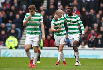 GLASGOW, SCOTLAND - MARCH 11: Moussa Dembele of Celtic celebrates after scoring his sides second goal with Scott Brown of Celtic during the Ladbrokes Scottish Premiership match between Rangers and Celtic at Ibrox Stadium on March 11, 2018 in Glasgow, Scot