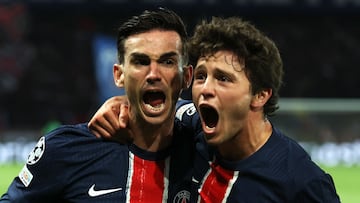 TOPSHOT - Paris Saint-Germain's Spanish midfielder #08 Fabian Ruiz (L) celebrates with his teammate Paris Saint-Germain's Portuguese midfielder #87 Joao Pedro Goncalves Neves (R) after scoring his team's first goal during the UEFA Champions League semi-final second leg football match between Paris Saint-Germain (PSG) and Arsenal at the Parc des Princes stadium in Paris, on May 7, 2025. (Photo by Thomas SAMSON / AFP)