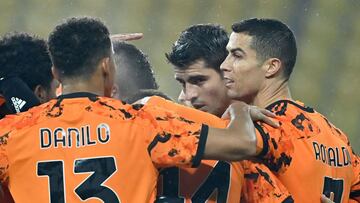 Juventus' Portuguese forward Cristiano Ronaldo (R) celebrates with teammates after scoring during the Italian Serie A football match Parma vs Juventus on December 19, 2020 at the Ennio-Tardini stadium in Parma. (Photo by Alberto PIZZOLI / AFP)