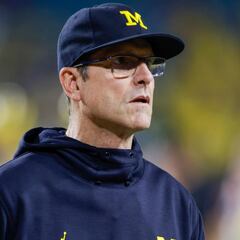 Why is Michigan coach Jim Harbaugh starting different quarterbacks in the first two games of 2022?