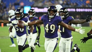 Aug 7, 2025; Baltimore, Maryland, USA; Baltimore Ravens linebacker Jay Higgins IV (49) celebrates after an interception against the Indianapolis Colts during the fourth quarter at M&T Bank Stadium. Mandatory Credit: Rafael Suanes-Imagn Images