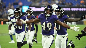 Aug 7, 2025; Baltimore, Maryland, USA; Baltimore Ravens linebacker Jay Higgins IV (49) celebrates after an interception against the Indianapolis Colts during the fourth quarter at M&T Bank Stadium. Mandatory Credit: Rafael Suanes-Imagn Images