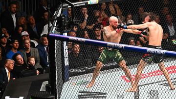 US President Donald Trump, Elon Musk and his son X � A-12 watch the featherweight fight between Australian fighter Alexander Volkanovski and Brazilian fighter Diego Lopes (R) during UFC 314 at the Kaseya Center in Miami, Florida, in the early hours of April 13, 2025. (Photo by Mandel NGAN / AFP)