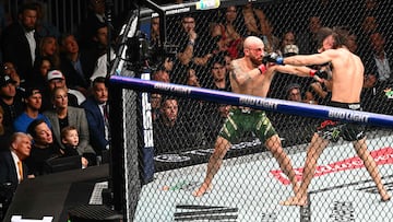 US President Donald Trump, Elon Musk and his son X � A-12 watch the featherweight fight between Australian fighter Alexander Volkanovski and Brazilian fighter Diego Lopes (R) during UFC 314 at the Kaseya Center in Miami, Florida, in the early hours of April 13, 2025. (Photo by Mandel NGAN / AFP)