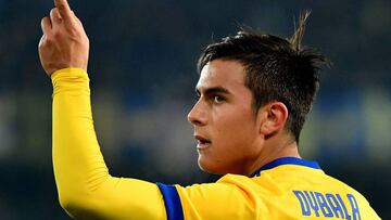 Juventus's forward from Argentina Paulo Dybala  celebrates after scoring a goal during the Italian Serie A football match Verona vs Juventus on December 30, 2017 at Marcantonio Bentegodi stadium in Verona. / AFP PHOTO / ALBERTO PIZZOLI