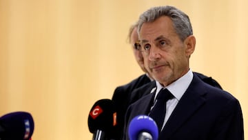 Former French President Nicolas Sarkozy talks to journalists after the verdict in his trial with other defendants on charges of corruption and illegal financing of an election campaign related to alleged Libyan funding of his successful 2007 presidential bid, at the courthouse in Paris, France, September 25, 2025. REUTERS/Stephanie Lecocq