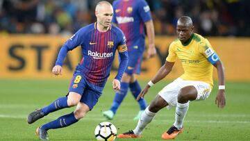 JOHANNESBURG, SOUTH AFRICA - MAY 16: Andres Iniesta of Barcelona FC and Hlompho Kekana of Mamelodi Sundowns during the International Club Friendly match between Mamelodi Sundowns and Barcelona FC at FNB Stadium on May 16, 2018 in Johannesburg, South Af