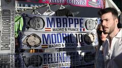Football scarves of French footballer Kylian Mbappe , Croatian player Luka Modric and Briton Jude Bellingan are displayed at a street vendor stand outside the Santiago Bernabeu stadium in Madrid prior to the celebration in London of the UEFA Champions League final football match between Borussia Dortmund and Real Madrid, on June 1, 2024. (Photo by Thomas COEX / AFP)