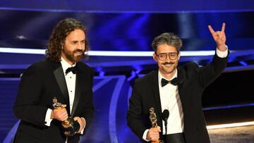 Spanish director and animator Alberto Mielgo (R) and Spanish producer Leo Sanchez (L) accepts the award for Best Animated Short Film for "The Windshield Wiper" onstage during the 94th Oscars at the Dolby Theatre in Hollywood, California on March 27, 2022. (Photo by Robyn Beck / AFP) (Photo by ROBYN BECK/AFP via Getty Images)