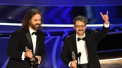 Spanish director and animator Alberto Mielgo (R) and Spanish producer Leo Sanchez (L) accepts the award for Best Animated Short Film for "The Windshield Wiper" onstage during the 94th Oscars at the Dolby Theatre in Hollywood, California on March 27, 2022. (Photo by Robyn Beck / AFP) (Photo by ROBYN BECK/AFP via Getty Images)