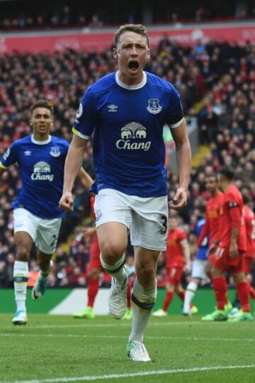 Everton's English defender Matthew Pennington celebrates after scoring their first goal during the English Premier League football match between Liverpool and Everton at Anfield