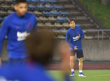 FC Barcelona's Japanese player Hiroki Abe (rear, R) warms up before a training session ahead of the Rakuten Cup football match with Chelsea, in Machida, suburban Tokyo on July 22, 2019. - Barcelona and Chelsea will play for the Rakuten Cup in Saitama on J