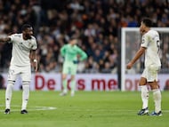 Real Madrid's German defender #22 Antonio Ruediger speaks to Real Madrid's English midfielder #05 Jude Bellingham during the Spanish league football match between Real Madrid CF and Sevilla FC at Santiago Bernabeu Stadium in Madrid on December 20, 2025. (Photo by Oscar DEL POZO / AFP)