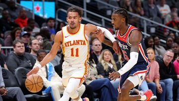 ATLANTA, GEORGIA - NOVEMBER 01: Trae Young #11 of the Atlanta Hawks drives against Delon Wright #55 of the Washington Wizards during the first quarter at State Farm Arena on November 01, 2023 in Atlanta, Georgia. NOTE TO USER: User expressly acknowledges and agrees that, by downloading and/or using this photograph, user is consenting to the terms and conditions of the Getty Images License Agreement. Kevin C. Cox/Getty Images/AFP (Photo by Kevin C. Cox / GETTY IMAGES NORTH AMERICA / Getty Images via AFP)