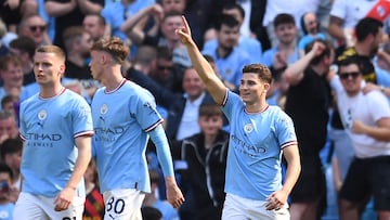 Manchester City's Argentinian striker Julian Alvarez (R) celebrates scoring the opening goal during the English Premier League football match between Manchester City and Chelsea at the Etihad Stadium in Manchester, north west England, on May 21, 2023. (Photo by Oli SCARFF / AFP) / RESTRICTED TO EDITORIAL USE. No use with unauthorized audio, video, data, fixture lists, club/league logos or 'live' services. Online in-match use limited to 120 images. An additional 40 images may be used in extra time. No video emulation. Social media in-match use limited to 120 images. An additional 40 images may be used in extra time. No use in betting publications, games or single club/league/player publications. / 