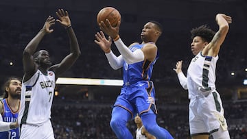 Oct 31, 2017; Milwaukee, WI, USA; Oklahoma City Thunder guard Russell Westbrook (0) takes a shot between Milwaukee Bucks center Thon Maker (7) and forward D.J. Wilson (5) in the second quarter at BMO Harris Bradley Center. Mandatory Credit: Benny Sieu-USA TODAY Sports