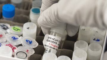 (FILES) In this file photo Dr. Nita Patel, Director of Antibody discovery and Vaccine development, lifts a vial with a potential coronavirus, COVID-19, vaccine at Novavax labs in Gaithersburg, Maryland on March 20, 2020, one of the labs developing a vaccine for the coronavirus, COVID-19. - The CEOs of nine companies developing vaccines against Covid-19 on September 8, 2020 pledged to &quot;uphold the integrity of the scientific process&quot; amid concern Donald Trump will pressure regulators to approve a vaccine ahead of the presidential election in November. &quot;We, the undersigned biopharmaceutical companies, want to make clear our ongoing commitment to developing and testing potential vaccines for COVID-19 in accordance with high ethical standards and sound scientific principles,&quot; said the CEOs.The statement was signed by AstraZeneca, BioNTech, GlaxoSmithKline, Johnson &amp; Johnson, Merck, Moderna, Novavax, Pfizer and Sanofi. (Photo by ANDREW CABALLERO-REYNOLDS / AFP)