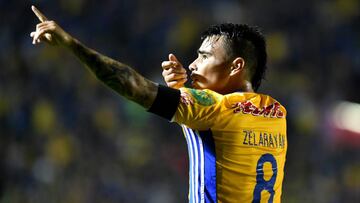 Lucas Zelarayan of the Tigres celebrates after scoring against Leon during the second leg of semifinal of their Mexican Apertura 2016 tournament football match at the Universitario stadium in Monterrey, Mexico, December 3, 2016. / AFP PHOTO / Julio Cesar Aguilar