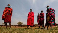 Maasai elders, wearing traditional costumes, with face masks on, due to the coronavirus disease (COVID-19) outbreak, gather at their homestead within the Orboma Manyatta in Sekenani, near the Maasai Mara game reserve in Narok County, Kenya August 10, 2020