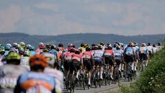 The pack rides during the third stage of the 76th edition of the Criterium du Dauphine cycling race, 181,7km between Celles-sur-Durolle and Les Estables, central France, on June 4, 2024. (Photo by Thomas SAMSON / AFP)