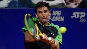 Argentine tennis player Federico Delbonis returns a ball to Argentine Juan Martin Del Potro during the ATP 250 Argentina Open tennis tournament in Buenos Aires, on February 8, 2022. (Photo by Juan Mabromata / AFP)