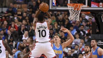 Oct 31, 2016; Toronto, Ontario, CAN; Toronto Raptors guard DeMar DeRozan (10) takes a jump shot over Denver Nuggets center Nikola Jokic (15) and guard Will Barton (5) in the first half at Air Canada Centre. Mandatory Credit: Dan Hamilton-USA TODAY