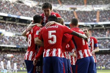 Griezmann celebrates with his teammates after scoring.