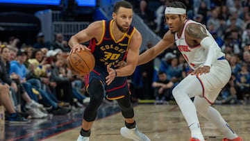 Golden State Warriors guard Stephen Curry (30) dribbles the basketball against New York Knicks guard Miles McBride (2) during the fourth quarter at Chase Center.