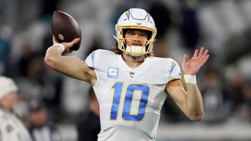 JACKSONVILLE, FLORIDA - JANUARY 14: Justin Herbert #10 of the Los Angeles Chargers warms up prior to a game against the Jacksonville Jaguars in the AFC Wild Card playoff game at TIAA Bank Field on January 14, 2023 in Jacksonville, Florida.   Courtney Culbreath/Getty Images/AFP (Photo by Courtney Culbreath / GETTY IMAGES NORTH AMERICA / Getty Images via AFP)