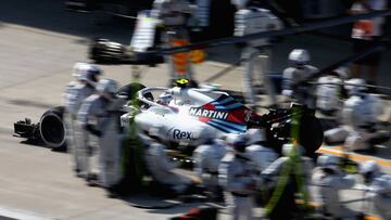 SHANGHAI, CHINA - APRIL 15: Lance Stroll of Canada driving the (18) Williams Martini Racing FW41 Mercedes makes a pit stop for new tyres during the Formula One Grand Prix of China at Shanghai International Circuit on April 15, 2018 in Shanghai, China. (Photo by Charles Coates/Getty Images)