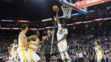 Mar 6, 2018; Oakland, CA, USA; Golden State Warriors forward Draymond Green (23) blocks a shot by Brooklyn Nets guard D&#039;Angelo Russell (1) in the fourth quarter at Oracle Arena. Mandatory Credit: John Hefti-USA TODAY Sports