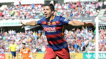 Luis Suarez of Barcelona celebrates scoring his team&#039;s second goal during the La Liga match between Granada and Barcelona at Estadio Nuevo Los Carmenes