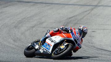 First-placed Ducati Team's Italian rider Andrea Dovizioso during the MotoGP race of the Moto Grand Prix de Catalunya at the Circuit de Catalunya on June 11, 2017 in Montmelo on the outskirts of Barcelona. / AFP PHOTO / Josep LAGO