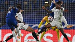 Chelsea&#039;s English striker Tammy Abraham (L) shoots and hits Rennes&#039; Brazilian defender Dalbert Henrique Chagas Estevao (R) in the arm, later being awarded a penalty following a VAR decision, during the UEFA Champions League Group E football matc