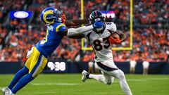 DENVER, COLORADO - AUGUST 26: Wide receiver Marvin Mims Jr. #83 of the Denver Broncos is tackled by cornerback Tre Tomlinson #6 of the Los Angeles Rams on a play that would result in a face mask penalty and disqualification of Tomlinson in the first quarter of a preseason game at Empower Field at Mile High on August 26, 2023 in Denver, Colorado.   Dustin Bradford/Getty Images/AFP (Photo by Dustin Bradford / GETTY IMAGES NORTH AMERICA / Getty Images via AFP)