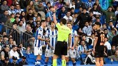 Real Sociedad's Spanish defender Aritz Elustondo receives a red card during the Spanish league football match between Real Sociedad and Valencia CF at the Anoeta stadium in San Sebastian on November 6, 2022. (Photo by ANDER GILLENEA / AFP)