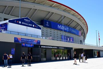 People walk outside the Wanda Metropolitan Stadium in Madrid on May 29, 2019 ahead of the UEFA Champions League final football match between Liverpool and Tottenham Hotspur on June 1. 