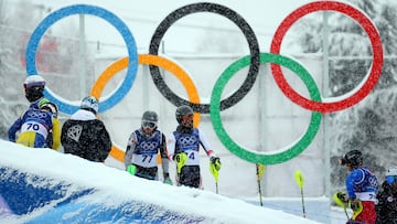 Milano Cortina 2026 Olympics - Alpine Skiing - Men's Slalom Run 1 - Stelvio Ski Centre, Bormio, Italy - February 16, 2026. Lasse Gaxiola of Mexico and Luka Buchukuri of Georgia during the men's slalom REUTERS/Denis Balibouse