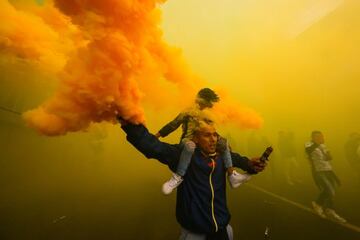 A fan holds a flare before the arriving of the team bus prior the 9th round match between Toluca and America as part of the Torneo Grita Mexico A21 Liga MX at Nemesio Diez Stadium on September 18, 2021 in Toluca, Mexico