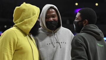 LOS ANGELES, CA - OCTOBER 03: Kevin Durant #7, Kyrie Irving #11, and James Harden #13 of the Brooklyn Nets get together during a time out in the first half of a pre-season game against Los Angeles Lakers at Staples Center on October 3, 2021 in Los Angeles