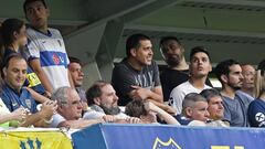 Former Boca Juniors player and second Vice President candidate for the opposition in upcoming Presidential election in Boca Juniors, Juan Roman Riquelme (C) attends to the match during between Boca Juniors and Argentinos Juniors during their Argentina First Division Superliga Tournament at La Bombonera stadium, in Buenos Aires, on November 30, 2019. (Photo by ALEJANDRO PAGNI / AFP)