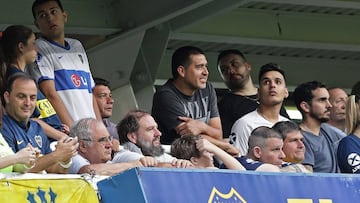 Former Boca Juniors player and second Vice President candidate for the opposition in upcoming Presidential election in Boca Juniors, Juan Roman Riquelme (C) attends to the match during between Boca Juniors and Argentinos Juniors during their Argentina First Division Superliga Tournament at La Bombonera stadium, in Buenos Aires, on November 30, 2019. (Photo by ALEJANDRO PAGNI / AFP)