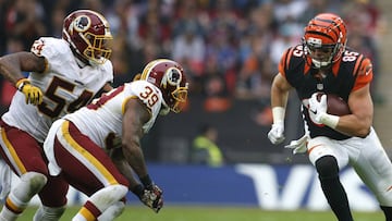 LONDON, ENGLAND - OCTOBER 30: Tyler Eifert #85 of the Cincinnati Bengals rushes the ball against Donte Whitner Sr. #39 and Mason Foster #54 of the Washington Redskins during the NFL International Series game at Wembley Stadium on October 30, 2016 in London, England. (Photo by Alan Crowhurst/Getty Images)